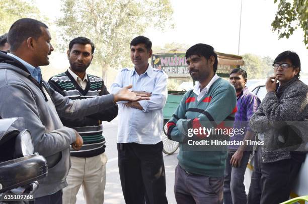 Uber cab drivers outside the Uber office at sector-29 during the Uber and Ola Cab owners and drivers strike on February 13, 2017 in Gurgaon, India....