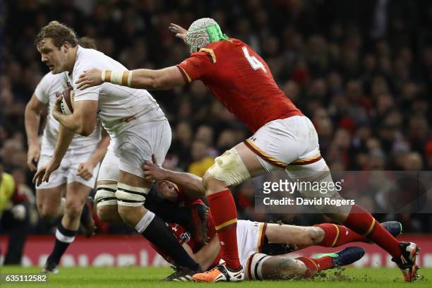 Joe Launchbury of England moves away from Jake Ball during the RBS Six Nations match between Wales and England at the Principality Stadium on...