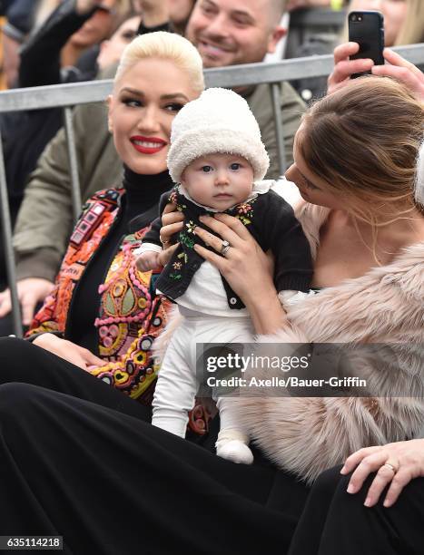 Model Behati Prinsloo, daughter Dusty Rose Levine and singer Gwen Stefani attend the ceremony honoring Adam Levine with star on the Hollywood Walk of...