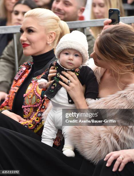 Model Behati Prinsloo, daughter Dusty Rose Levine and singer Gwen Stefani attend the ceremony honoring Adam Levine with star on the Hollywood Walk of...