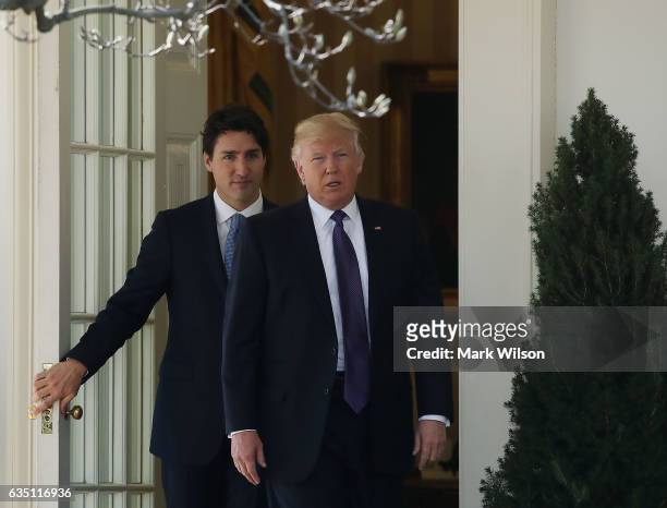 President Donald Trump walks with Canadian Prime Minister Justin Trudeau after a meeting at the White House on February 13, 2017 in Washington, DC....