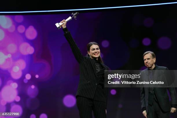Shooting Star Karin Franz Koerlof receives the award from actor Timothy Spall at the 'The Party' premiere during the 67th Berlinale International...
