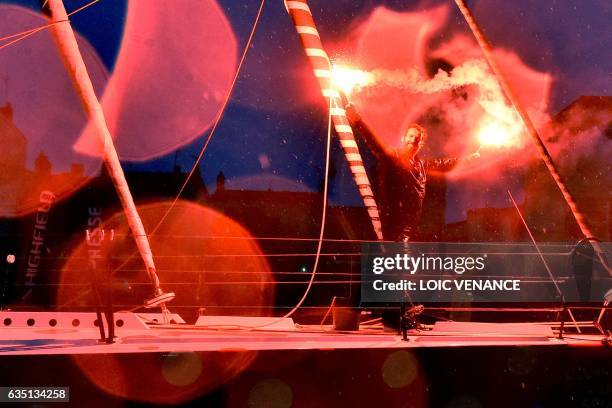 French skipper Eric Bellion celebrates aboard his Imoca 60 "Comme un seul Homme" as he arrives at Les Sables d'Olonne after placing 9th of the Vendee...