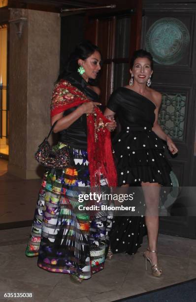 Political donor Sloan Barnett, right, exits the Breakers Hotel in Palm Beach, Florida, U.S., on Saturday, Feb. 11, 2017. There were camels in the...