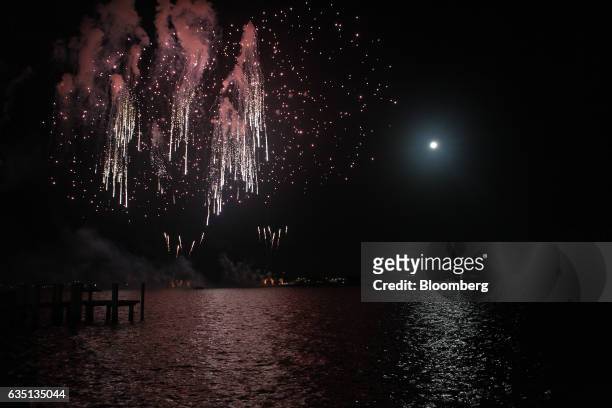 Fireworks go off over the Intracoastal Waterway in Palm Beach, Florida, U.S., on Saturday, Feb. 11, 2017. There were camels in the sand, a gondolier...