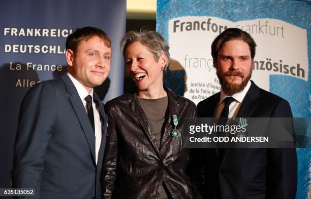 German actor Max Riemelt, German film expert Birgit Kohler and German actor Daniel Bruehl pose for a group photo after receving the Order of Arts and...