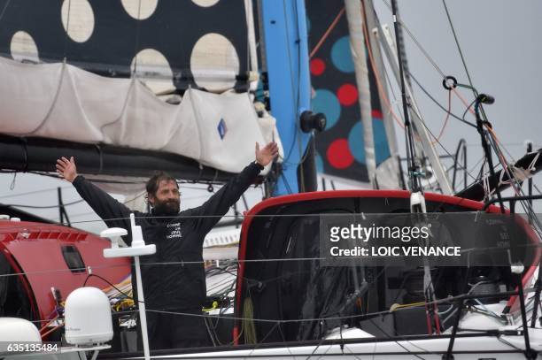 French skipper Eric Bellion celebrates aboard his Imoca 60 "Comme un seul Homme" as he arrives at Les Sables d'Olonne after placing 9th of the Vendee...