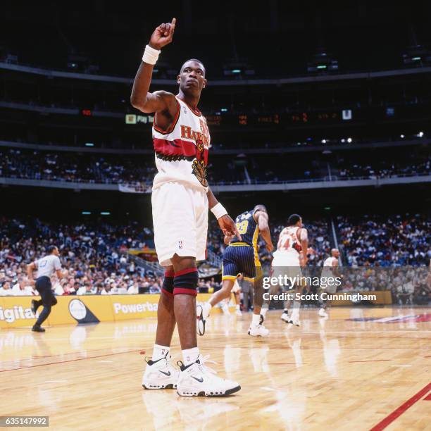 Dikembe Mutombo of the Atlanta Hawks waves his finger against the Indiana Pacers on April 9, 1998 at The Omni in Atlanta, Georgia. NOTE TO USER: User...