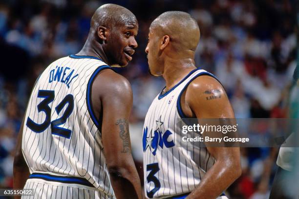 Shaquille O'Neal and Dennis Scott of the Orlando Magic against the Boston Celtics on January 30, 1996 at the Orlando Arena in Orlando, Florida. NOTE...