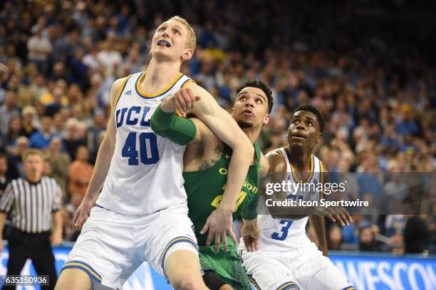 Center Thomas Welsh boxes out Oregon forward Dillon Brooks during an college basketball game between the Oregon Ducks and the UCLA Bruins on February...