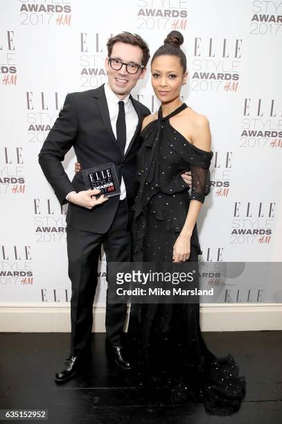 Presenter Thandie Newton and winner Erdem Moralioglu pose in the winners room with the British Designer of The Year award at the Elle Style Awards...