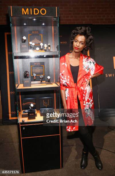 Mame Adjei poses with Mido Swiss Watches display during Nolcha Shows Runway New York Fashion Week Fall Winter 2017 at ArtBeam on February 13, 2017 in...