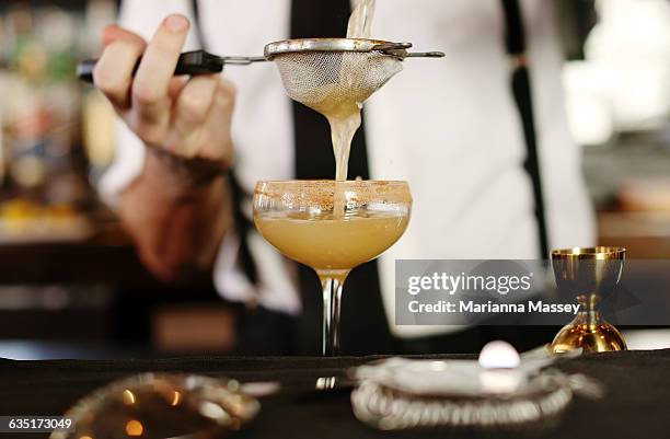 a cocktail being served at a bar - bartender bildbanksfoton och bilder