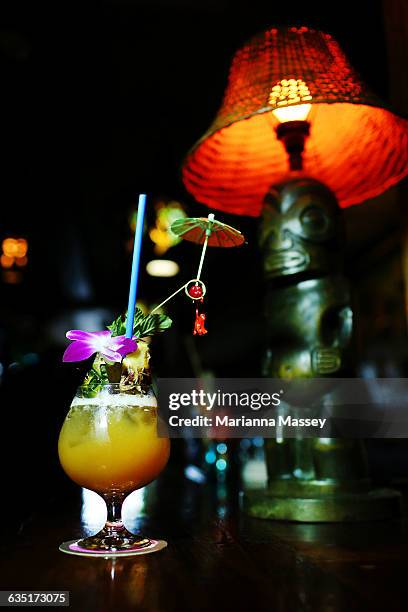 a tiki bar fruit cocktail - tiki stock pictures, royalty-free photos & images