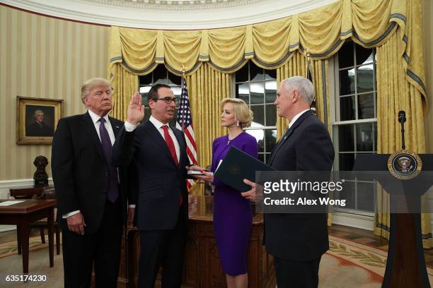 Former investment banker for Goldman Sachs Steven Mnuchin participates in a swearing-in ceremony, conducted by Vice President Mike Pence , as fiancée...