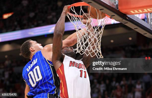 Dion Waiters of the Miami Heat dunks on Aaron Gordon of the Orlando Magic during a game at American Airlines Arena on February 13, 2017 in Miami,...