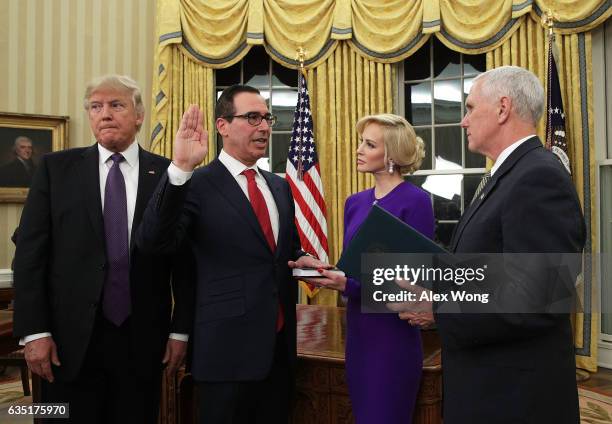 Former investment banker for Goldman Sachs Steven Mnuchin participates in a swearing-in ceremony, conducted by Vice President Mike Pence , as fiancée...