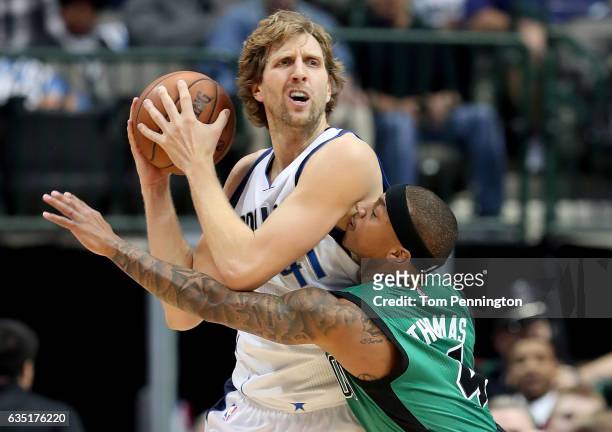 Dirk Nowitzki of the Dallas Mavericks controls the ball against Isaiah Thomas of the Boston Celtics in the first half at American Airlines Center on...