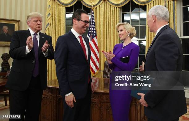 Former investment banker for Goldman Sachs Steven Mnuchin participates in a swearing-in ceremony, conducted by Vice President Mike Pence , as fiancée...