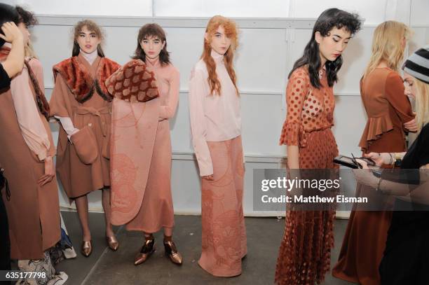 Models wait in line backstage before walking the runway at Katty Xiomara Backstage February 2017 during New York Fashion Week at Pier 59 on February...