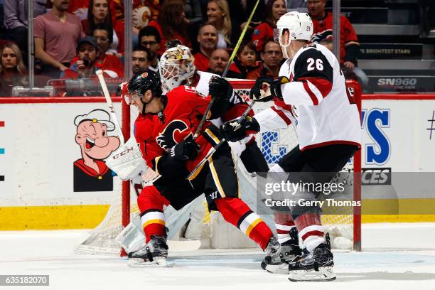 Johnny Gaudreau of the Calgary Flames skates against Michael Stone of the Arizona Coyotes during an NHL game on February 13, 2017 at the Scotiabank...