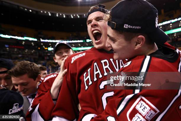 Jacob Olson of the Harvard Crimson and Devin Tringale celebrate after defeating Boston University Terriers 6-3 in the 2017 Beanpot Tournament...