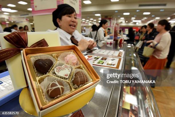 This photo taken on February 13, 2017 shows chocolates for sale at a floor prepared specially for Valentine's Day gifts at a department store in...