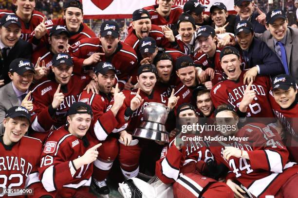 Members of the Harvard Crimson celebrate after defeating the Boston University Terriers 6-3 in the 2017 Beanpot Tournament Championship at TD Garden...