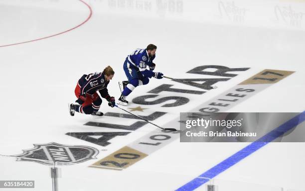 Cam Atkinson of the Columbus Blue Jackets and Nikita Kucherov of the Tampa Bay Lightning skate during the Bridgestone Fastest Skater competition as...