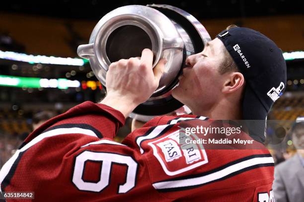 Ryan Donato of the Harvard Crimson kisses the Beanpole Trophy after defeating Boston University Terriers 6-3 in the 2017 Beanpot Tournament...