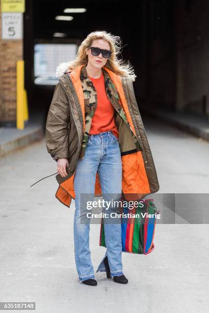Annabel Rosendahl wearing parka, denim jeans, Balenciaga bag outside Proenza Schouler on February 13, 2017 in New York City.
