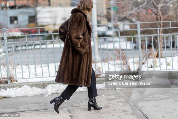 Anya Ziourova wearing a brown fur coat outside 3.1 Phillip Lim on February 13, 2017 in New York City.