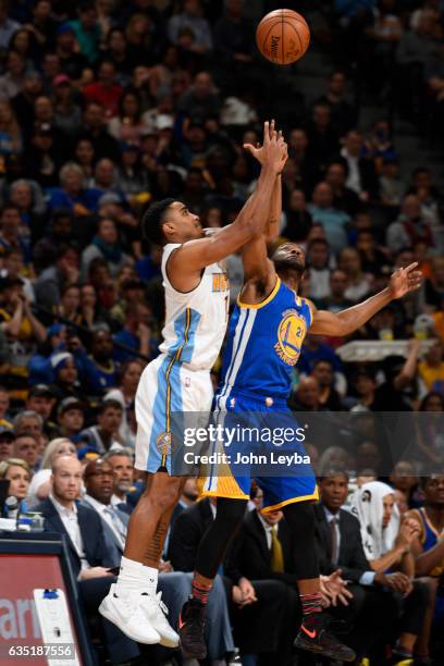 Denver Nuggets guard Gary Harris and Golden State Warriors guard Ian Clark battle for a rebound during the fourth quarter February 13, 2017 at Pepsi...
