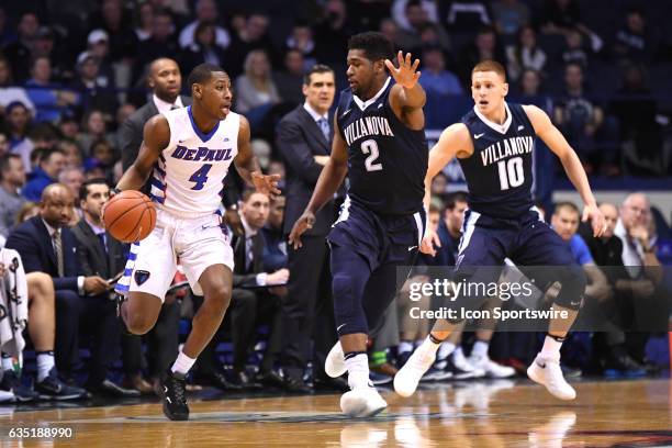 DePaul Blue Demons guard Brandon Cyrus controls the ball against Villanova Wildcats forward Kris Jenkins and Villanova Wildcats guard Donte...