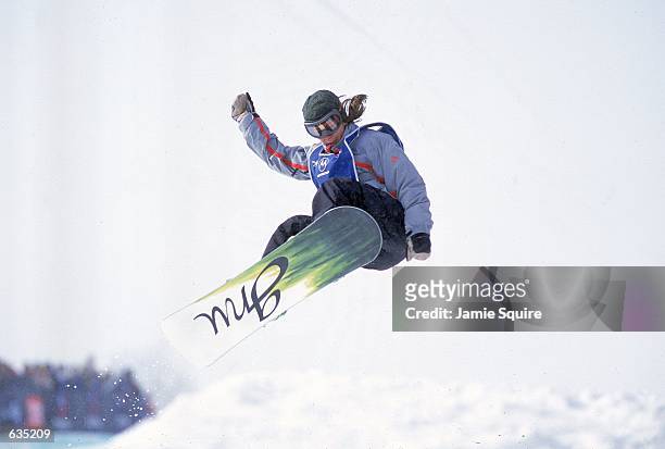 Barrett Christy makes a jump in the Snowboard Super Pipe Event during the ESPN Winter X Games at Mt. Snow, Vermont.Mandatory Credit: Jamie Squire...