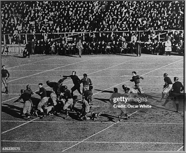 Play is made during the first football game ever played between teams from Harvard and Yale. The game was played at Hamilton Park on Saturday,...