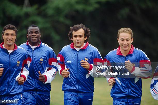French soccer players Bernard Casoni, Basile Boli, Michel Platini and Jean-Pierre Papin during a training session.