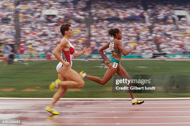 Grit Breuer and Cathy Freeman compete during the Women's 400-meter quarter-final at the 1996 Olympic Games.