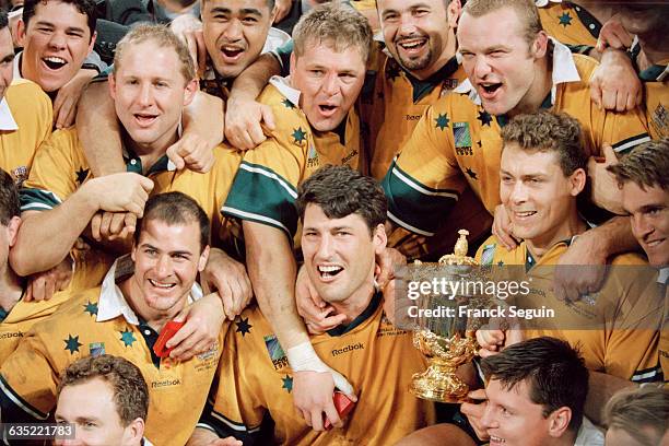 Australian captain John Eales and his teammates celebrate after winning the 1999 Rugby Union World Cup final against France. Australia won the final...