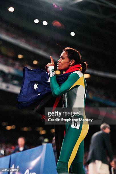 Cathy Freeman from Australia celebrates after winning the women's 400-meter sprint of the 2000 Olympics.