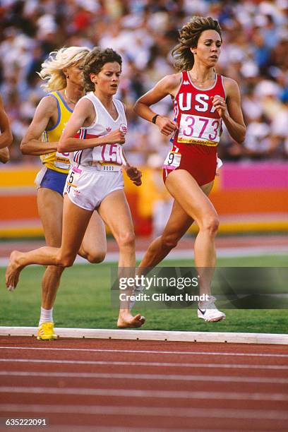 Zola Budd of Great Britain and Mary Decker of the United States run the first lap of the Womens 3000-meter final in the Coliseum. Behind Decker is...