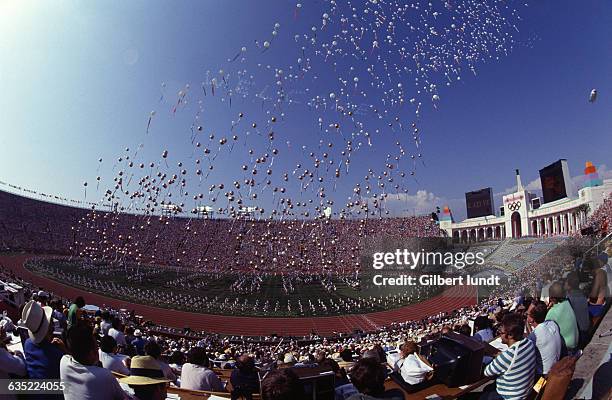 Host of balloons is released into the air by performers during the opening ceremony of the 23rd Olympic Games held in Olympic Statium, Los Angeles in...