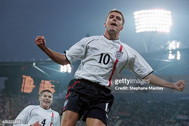 Michael Owen celebrates scoring a goal during a 2002 FIFA World Cup qualifying match against Germany. England won 5-1.