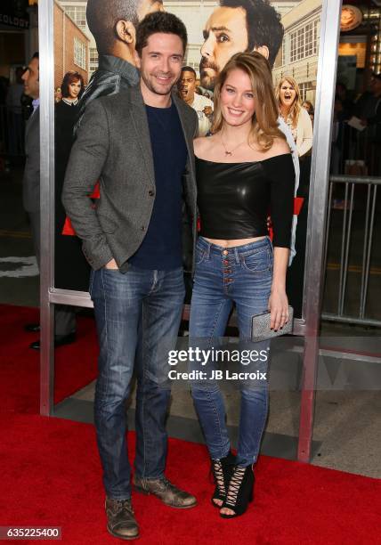 Topher Grace and Ashley Hinshaw attend premiere of Warner Bros. Pictures' 'Fist Fight' on February 13, 2017 in Westwood, California.