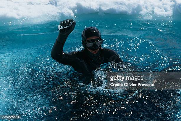 Diving under ice without breathing apparatus. Frenchman William Peyre celebrates breaking the world record .