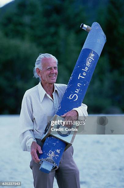 John Dobson, who revolutionized the design of amateur telescopes, holds his daylight-safe sun telescope at Strathcona Park.