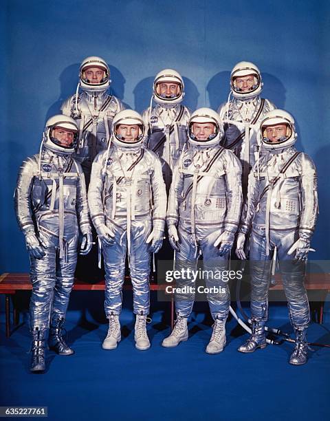 The original seven Project Mercury astronauts: front row, left to right, are Walter M. Schirra, Jr., Donald "Deke" K. Slayton, John Glenn Jr., and M....