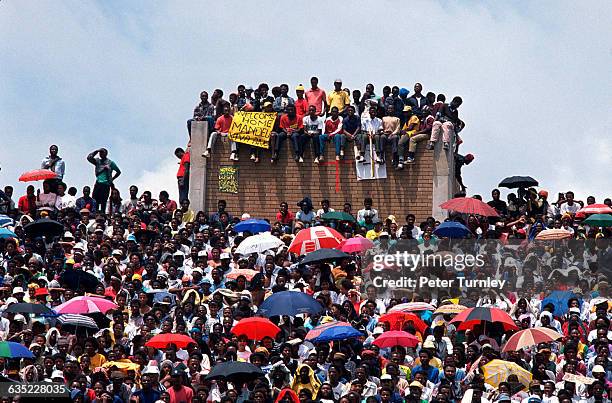 Young black South Africans gather at a rally celebrating Nelson Mandela's release from prison at a Soweto stadium.