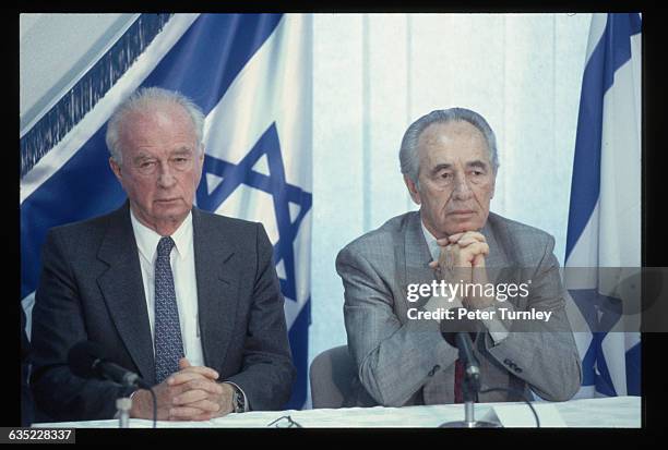 Israeli Prime Minister Yitzhak Rabin, left, and Foreign Minister Shimon Peres, together with PLO leader Yasser Arafat, won the Nobel Peace Prize for...