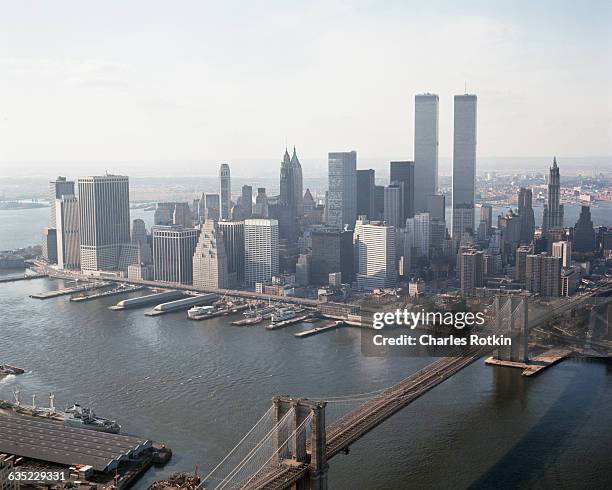 Looking southwest from Brooklyn at Lower Manhattan. Sites include the Brooklyn Bridge crossing the East River, the South Street Seaport, and the twin...